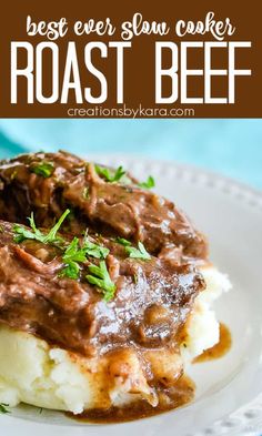 the best ever slow cooker roast beef over mashed potatoes on a white plate