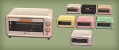 several different colored toasters and microwaves on a green background