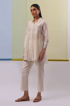 Buy Off White Handwoven Cotton Chanderi Leen Bloom Pleated Tunic With Pant For Women by Sue Mue Online at Aza Fashions. Spring Kurta With Floral Embroidery And 3/4 Sleeves, Long Sleeve Kurta With Floral Embroidery For Work, Long Sleeve Floral Embroidery Kurta For Work, Long Sleeve Chikankari Kurta For Work, Long Sleeve Sets With Embroidered Hem For Spring, Spring Workwear Kurta With Resham Embroidery, Spring Resham Embroidery Kurta For Workwear, Spring Long Sleeve Kurta With Pintucks, Spring Long Sleeve Pintuck Kurta