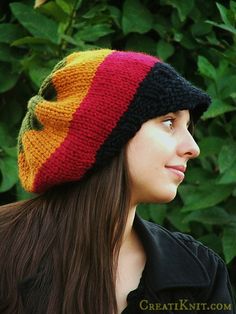 a woman wearing a multi colored knitted hat with the words pattern written below it