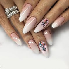 a woman's nails with flowers on them