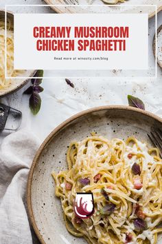 creamy mushroom chicken spaghetti in a white bowl on a table with glasses and napkins