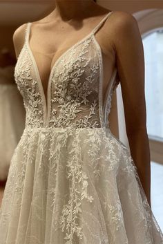 the back of a wedding dress with straps