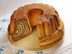 a bundt cake on a plate with one slice cut out