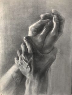 a pencil drawing of two hands holding each other