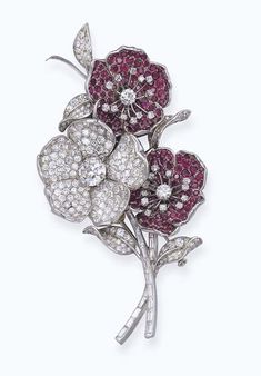 A DIAMOND AND RUBY FLOWER BROOCH, MOUNTED BY BOUCHERON  Designed as a three wild roses of pavé-set diamonds and rubies to the baguette-cut diamond stems, the two ruby flowerheads detachable Red Carpet Jewelry, Ruby Flower, Pink Chalcedony, French Jewelry, Flower Carving, Jewelry Words, Brooch Bouquets, Royal Jewels