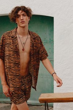 Animal print camp-collar woven camp-collar shirt inspired by traditional Aloha shirts. Fabric is lightweight, breathable, and drapes effortlessly. Chest patch pocket 100% viscose Wooden buttons Model is 5' 9" and is wearing a size M Black Runners, The Runaway, Animal Print Outfits, Pet Tiger, Total Look, Mens Swim Trunks, Aloha Shirt, Viscose Fabric, Man Swimming