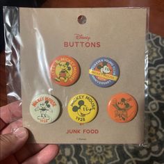 a package of disney buttons with mickey mouse on them