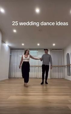 two people standing in an empty room holding hands with the words 25 wedding dance ideas