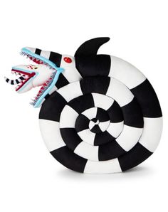 a black and white toy with a dragon on it's back, sitting in front of a white background