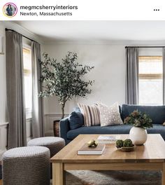 a living room filled with furniture and a wooden coffee table