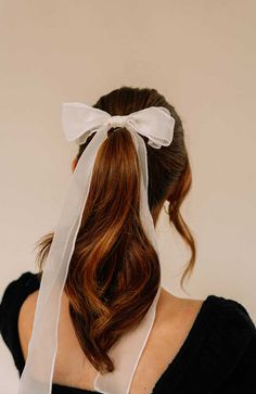 The L. Erickson USA Lola Bow Barrette is a stylish bow with sheer fabric and a long ribbon tail. The Lola Bow Barrette is a quick and easy choice to sweep back your hair and enjoy a comfortable, all-day hold. Add a bit of playfulness with a sleek style to your outfit with this Lola Bow Hair Clip for an easy hair style. Handmade in America, this barrette features a French style barrette clasp and sheer chiffon fabric.Product Features:- Handmade in the USA- Great for most hair types- Comfortable, Ribbon Hair Clip, Short Ponytail, Long Bow, Bow Barrette, Bow Hair Clip, French Hair, Ribbon Hair, Bow Hair, Sheer Chiffon