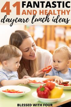 a woman and two children sitting at a table with plates of food