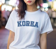 Perfect for any fan of K-pop, K-drama, or Korea in general! If you love the rich and diverse culture of Korea, this Korea T-Shirt is a perfect way to express your love and admiration. Get ready to turn heads and spark conversations with this trendy and unique piece. Embrace the spirit of K-pop and K-drama with our Korea T-Shirt, and let your fashion choices make a statement about your love for all things Korean. Made with high-quality materials, this t-shirt is designed to be comfortable and durable, ensuring that you can show off your love for Korea for years to come. Unisex, soft and high-quality t-shirt. The T-Shirt is created on demand. No returns, no exchanges. South Korea University, University Fashion, Korea University, Korean Shirt, Minimalist Streetwear, University Style, Fashion White, K Drama, High Quality T Shirts