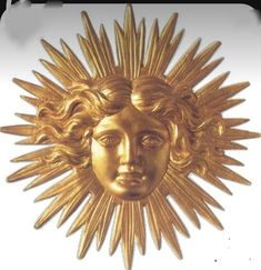 a gold sun face is shown against a white background