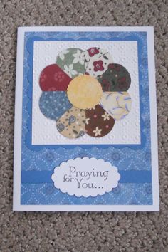 a card with an image of a flower on it and the words praying for you