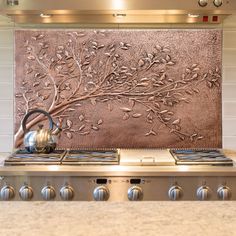 a stove top with a tea kettle on it