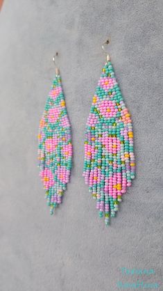 These handmade author's bright turquoise pink earrings are made of high-quality Czech beads and strong synthetic thread.In these unique earrings I use my author's scheme Abstract flowers minimalism . 100% hand made with love!  Copy without my permission is prohibited  Measurements: Length with hook - about 10,5 cm( 4.13 inch ),Width -3 cm (1,18 inch) Materials: Silver  plated ear hooks Czech glass beads Tytan Thread Handmade Adjustable Pink Beaded Earrings, Handmade Pink Beaded Earrings With Round Beads, Handmade Pink Beaded Earrings, Handmade Pink Chandelier Earrings As Gift, Handmade Pink Beaded Dangle Earrings, Pink Handmade Dangle Beaded Earrings, Handmade Pink Beaded Drop Earrings, Pink Handmade Beaded Dangle Earrings, Pink Tiny Beads Drop Earrings