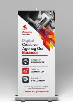 a roll - up banner with an image of a person on a laptop and the words digital creative agency our business