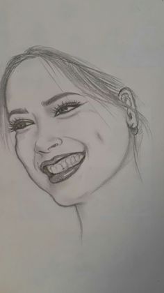 a pencil drawing of a smiling woman's face