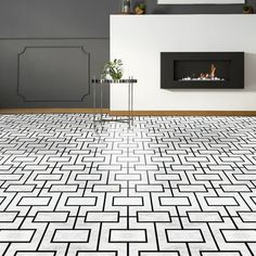 a modern living room with white and black tiles on the floor, fireplace in the background