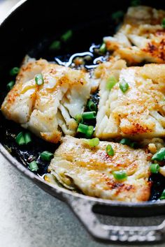 some food is cooking in a pan on the table