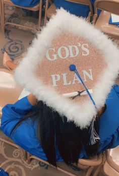 a person wearing a graduation cap with the words god's plan on it