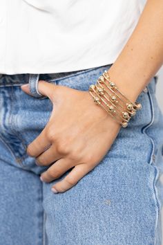 Handmade in Brazil, the Bianca Wrap Bracelet will amplify any casual outfit you have on. This stunning statement piece is Brazilian gold filled featuring a fabulous multi wrap design with small and large gold beads. 2.5" diameter Elegant Gold Hand Wrapped Stretch Bracelet, Gold Hand Wrapped Bracelet, Gold Hand Wrapped Bracelets For Party, Hand Wrapped Gold Bracelets For Party, Brazilian Gold, Sunglass Chain, Jewelry Studio, Original Gift, Cz Stone