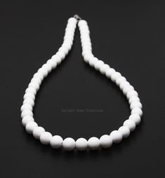 Product Details : ITEM : WHITE ONYX BEADED NECKLACE Item Code : DGC2085 Gemstone Name : WHITE ONYX Chain Style : BEADED Beads Shape : SMOOTH ROUND Beads Size : 8mm Approx Length : 18 INCH WITH LOBSTER CLASP Weight : 240 Cts. Approx Customization : **Available** Please Feel Free To Contact If You Have Any Query. White Gemstone Beaded Round Necklaces, White Gemstone Beads Round Necklaces, White Gemstone Beads Necklaces, White Necklaces With Round Gemstone Beads, White Round Beaded Necklace 8mm, White Necklace With 8mm Beads, Pearl White Necklace With 8mm Beads For Jewelry Making, White Gemstone Beads Necklace, White Faceted Bead Round Necklaces