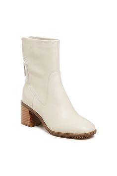 Leather upper Microsuede, latex insole Recycled German, rubber sole Leather-stacked heel Back zip Imported | Island Heeled Boots by Kelsi Dagger Brooklyn in White, Women's, Size: 6.5, Leather/Rubber/Suede at Anthropologie Stacked Heel Boots, Heel Boots, Stacked Heel, Boot Shoes Women, Shoe Shop, Heeled Boots, Rubber Sole, Brooklyn, Heel Height