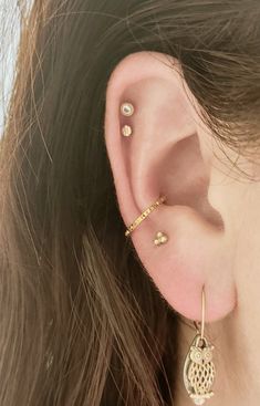 "This Petite Pyramid Titanium Conch Hoop is THE PERFECT minimalist conch hoop. It is dainty and delicate. And it *Sparkles* even without gems. These hoops are 16 guage, with diameter options available in 10,11 and 12 mm. Polished Titanium and PVD Gold are available. Color may vary due to differences in electronic screen settings. CUSTOM ANODIZING AVAILABLE Please message me if you would like a custom color!! Prior to placing an order for a hoop, please know the hoop size that you need. Hoop size Everyday Internally Threaded Hoop Cartilage Earrings, Tiny Gold Huggie Cartilage Earrings, Internally Threaded Small Hoop Piercings For Everyday, Dainty Internally Threaded Small Hoop Piercings, Dainty Internally Threaded Hoop Piercings, Nickel-free Small Hoop Gold Piercings, Dainty Small Hoop Internally Threaded Piercings, Hypoallergenic Gold Small Hoop Piercings, Gold Small Hoop Piercings Internally Threaded