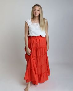 FINAL SALE Fabric: 100% cotton Size comparisons: S-2/4, M-6/8, L-10/12 Waist measurements laying flat not stretched: S-14", M-15", L-16" Length - 41" Makenna is wearing the medium. Imported Summer Cotton Stretch Maxi Skirt, Summer Stretch Cotton Maxi Skirt, Fitted Orange Cotton Skirt, Orange Fitted Cotton Skirt, Casual Orange Tiered Skirt Bottoms, Casual Orange Tiered Skirt, Fitted Cotton Maxi Skirt For Vacation, Orange Cotton Skirt For Vacation, Casual Orange Cotton Skirt