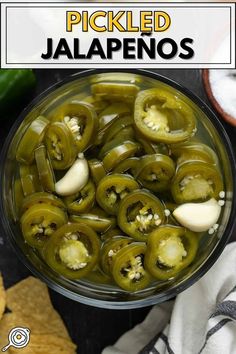 pickled jalapenos in a glass bowl with tortilla chips on the side