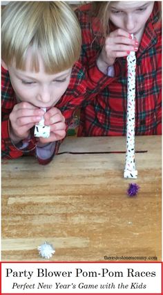 two young children playing with paper flowers on a wooden table and text party blower pom - pom races perfect new year's game with the kids