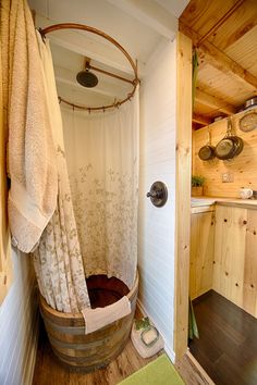 a bathroom with a shower, sink and tub in it's own cabin style setting