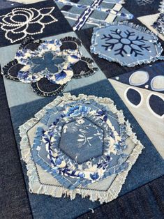 blue and white patchwork quilts with snowflakes on the top one is made from old jeans