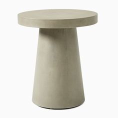 a round concrete table on a white background