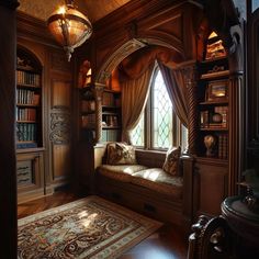 a window seat in the corner of a room with bookshelves and rug on the floor