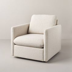 a white chair sitting on top of a gray floor