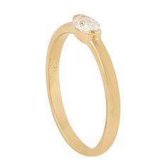 a yellow gold ring with a single diamond on the front and side, against a white background