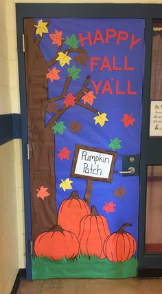 a door decorated with pumpkins and fall leaves for a happy fall y'all