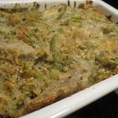 a casserole dish with meat and vegetables in it