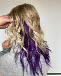 16 Blonde Hair With Purple Underneath Ideas To Try Now Dark Purple Peekaboo Hair Blonde, Blond With Purple Underneath, Peekaboo Hair Color Long Hair, Vivid Color Underneath, Fun Colors With Blonde Hair, Blond With Purple Hair, Blonde Hair With Different Color Underneath, Color Peekaboo Hair Blonde