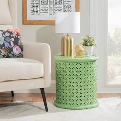 a living room scene with focus on the end table and chair in the foreground