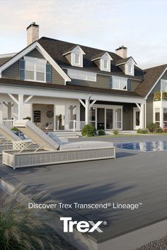 a large house with a pool in front of it