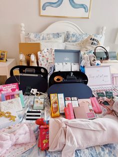 an assortment of personal items laid out on a bed