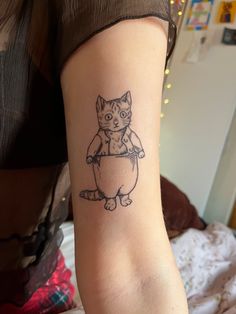 Line art tattoo of Tom Kitten on the inside of an arm Tom Kitten Tattoo, Beatrix Potter Tattoo, Peter Rabbit Tattoo, Peter Rabbit Tattoos, Kitten Tattoo, Tom Kitten, Line Art Tattoo, Beatrice Potter, Rabbit Tattoo