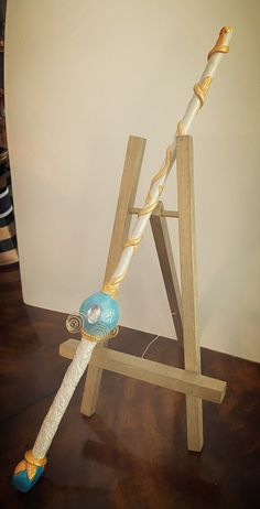 a wooden stand with a toothbrush holder on it