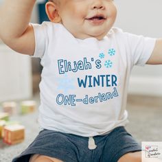 "Step into a magical world of snowflakes and joy as you celebrate your little one's first birthday with our enchanting \"Baby's Winter One-derland\" custom shirt. This personalized snowflake-themed tee captures the beauty of the season and adds a touch of frosty elegance to your baby's milestone celebration. How to Order: -Choose the size and color of the shirt from the dropdown menus. -In the \"Personalization\" section, please provide your child's name and color theme for customization. -Add to cart and proceed to checkout. Our unique and eye-catching shirts are crafted using the latest DTG (Direct-to-Garment) technology, ensuring high-quality prints that capture every detail of our designs. While we take immense care to maintain color accuracy in our products, it's important to remember 1st Birthday Winter, Winter First Birthday, Toddler Printables, Winter Onederland Party, First Birthday Shirt, Kids Birthday Shirts, 1st Birthday Shirts, Winter Wonderland Party, First Birthday Shirts