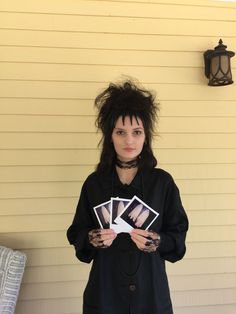 a woman with black hair holding four photos